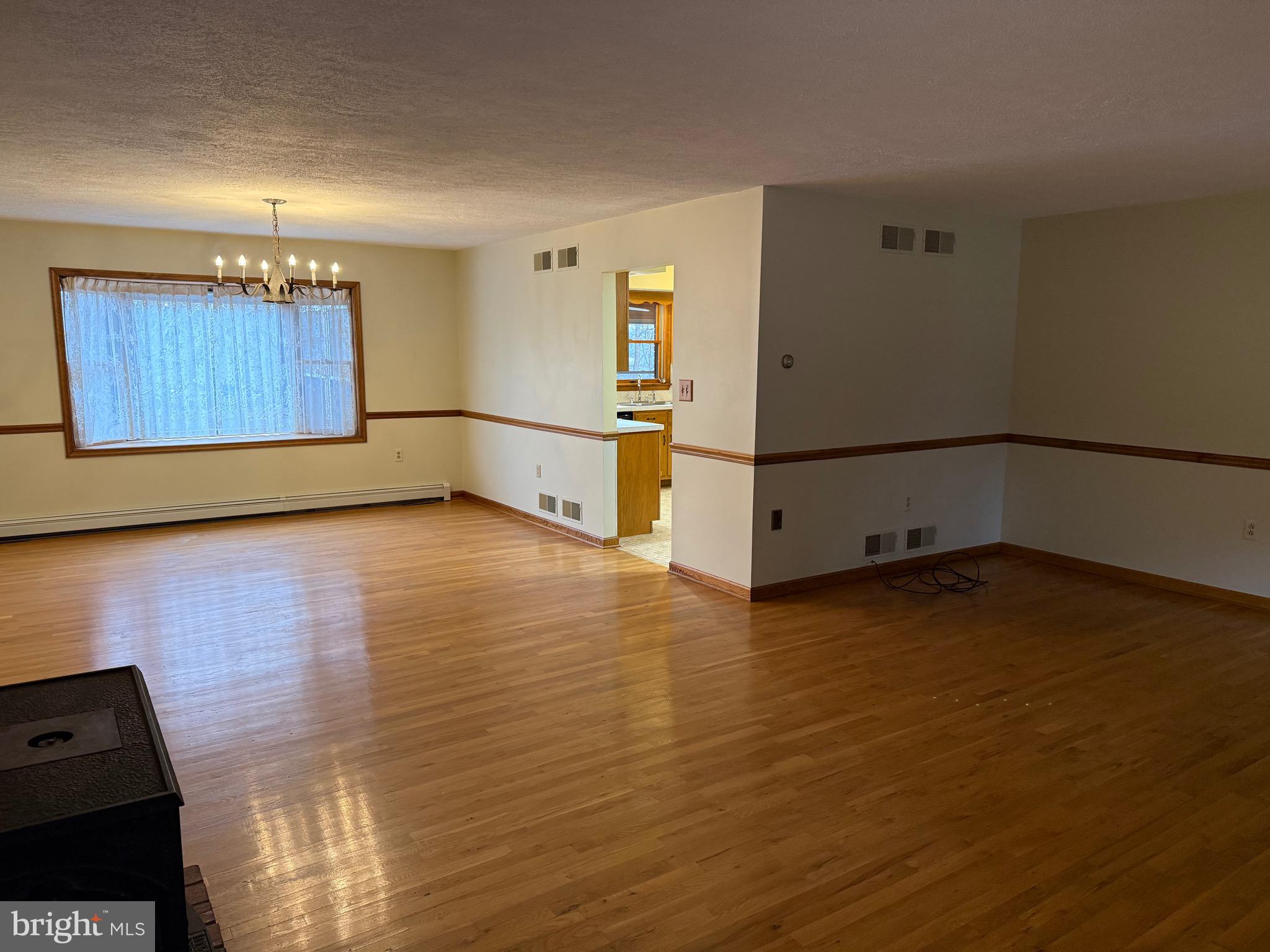 992 Silver Lane Berkeley Springs, WV 25411 - Photo 8 of 44 a view of a room with wooden floor