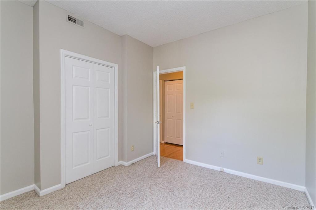 301 Queens Road, Unit 201 Charlotte, NC 28204 - Photo 11 of 24 an empty room with closet