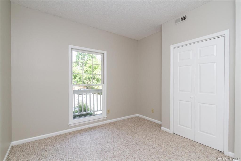 301 Queens Road, Unit 201 Charlotte, NC 28204 - Photo 12 of 24 an empty room with a window