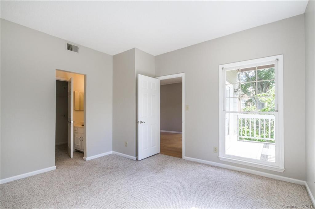 301 Queens Road, Unit 201 Charlotte, NC 28204 - Photo 17 of 24 an empty room with windows and closet