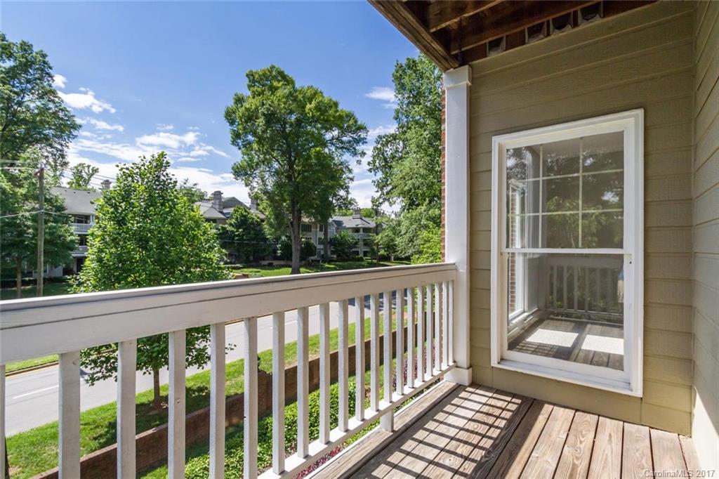 301 Queens Road, Unit 201 Charlotte, NC 28204 - Photo 22 of 24 a view of a balcony with wooden floor