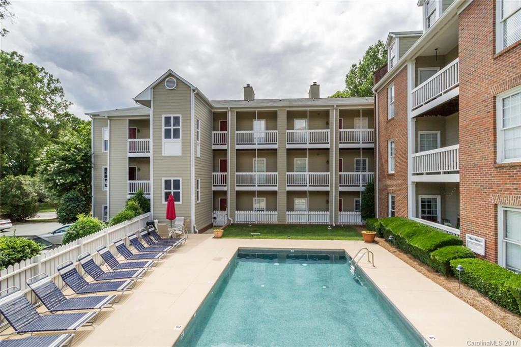 301 Queens Road, Unit 201 Charlotte, NC 28204 - Photo 23 of 24 a front view of a house with a yard