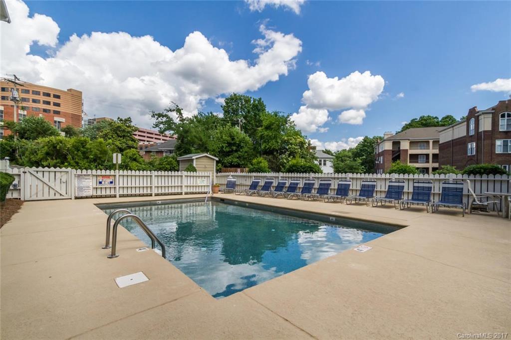 301 Queens Road, Unit 201 Charlotte, NC 28204 - Photo 24 of 24 a view of a swimming pool with a roof deck