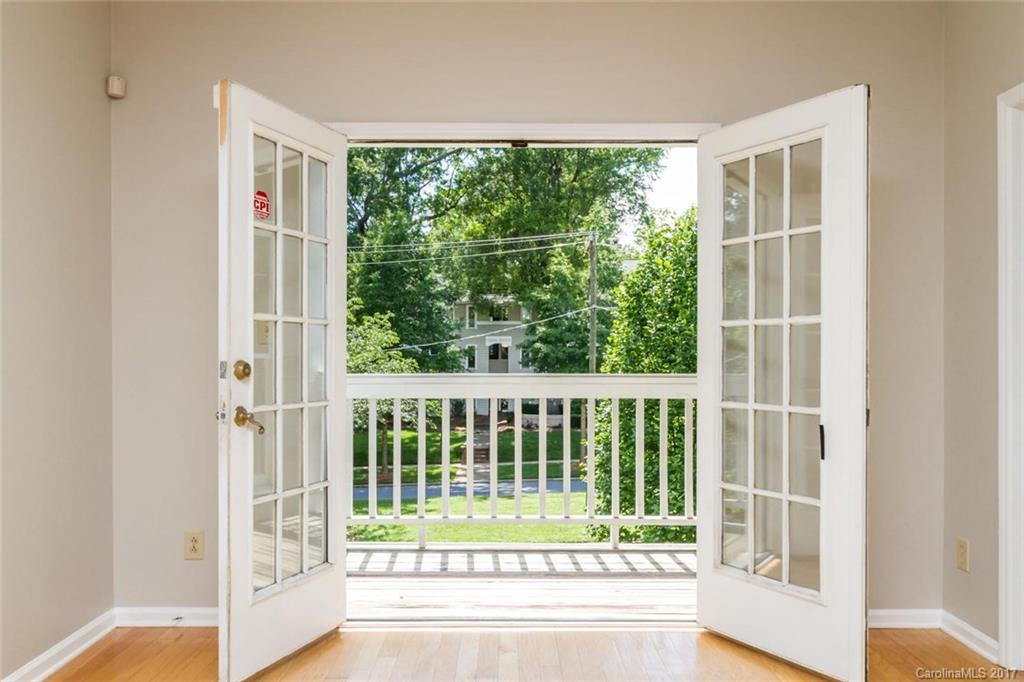 301 Queens Road, Unit 201 Charlotte, NC 28204 - Photo 6 of 24 a view of porch with small green space
