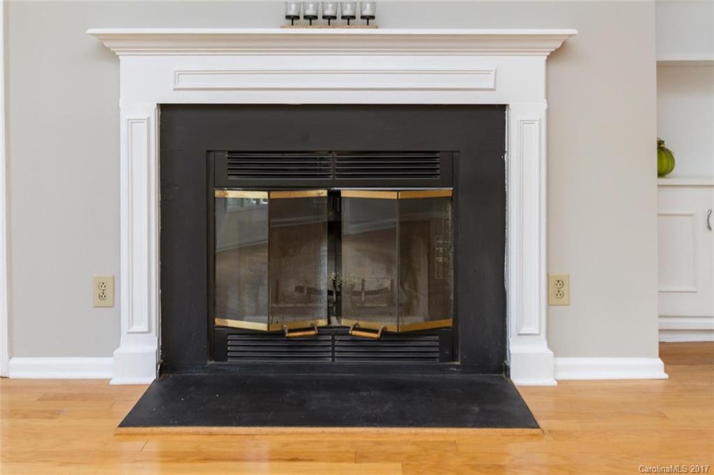 301 Queens Road, Unit 201 Charlotte, NC 28204 - Photo 7 of 24 a living room with a fireplace