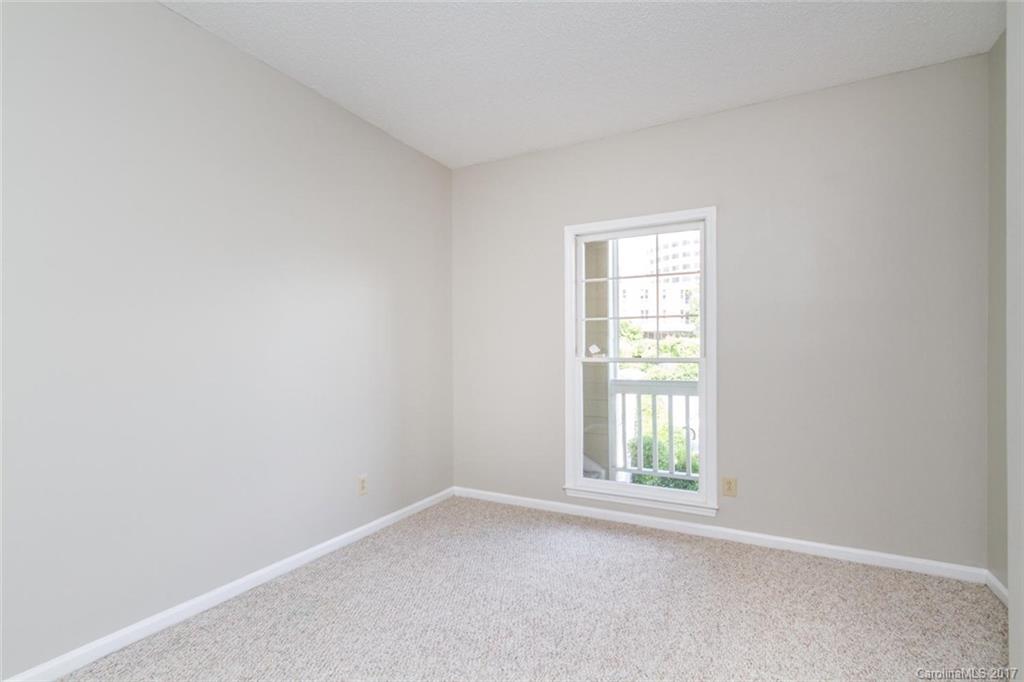 301 Queens Road, Unit 201 Charlotte, NC 28204 - Photo 10 of 24 an empty room with a window