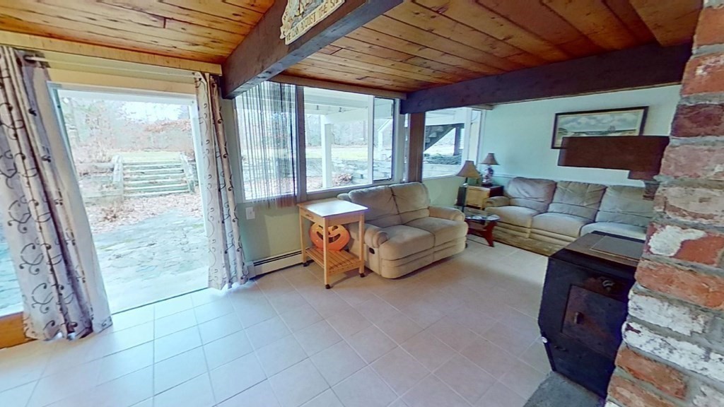 10 Bunker Circle Sandwich, MA 02563 - Photo 15 of 19 a living room with furniture and a large window