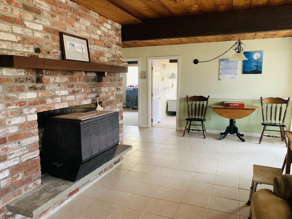 10 Bunker Circle Sandwich, MA 02563 - Photo 16 of 19 a building outdoor space with patio furniture and a fireplace