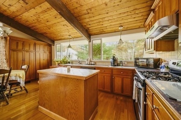 10 Bunker Circle Sandwich, MA 02563 - Photo 2 of 19 a kitchen with stainless steel appliances granite countertop sink stove and cabinets