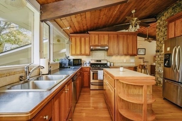 10 Bunker Circle Sandwich, MA 02563 - Photo 3 of 19 a kitchen that has a sink and a stove in it