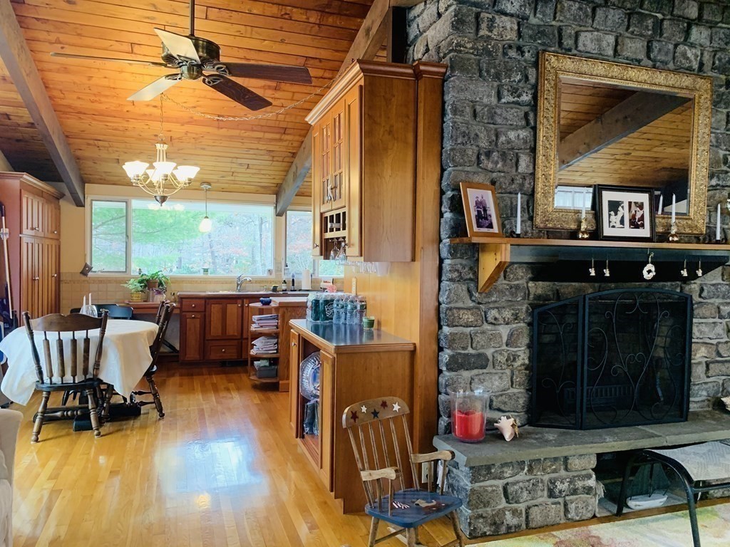 10 Bunker Circle Sandwich, MA 02563 - Photo 5 of 19 a living room with fireplace furniture and a wooden floor