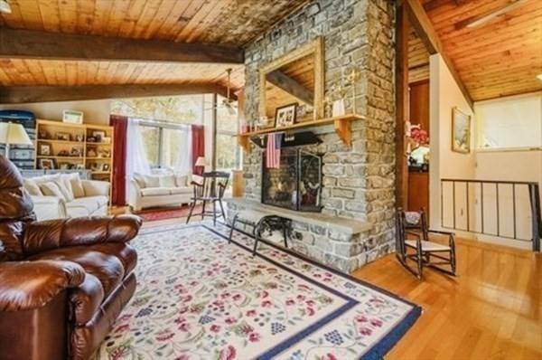 10 Bunker Circle Sandwich, MA 02563 - Photo 8 of 19 a living room with furniture a rug and a floor to ceiling window
