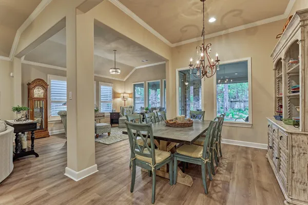a living room with stainless steel appliances kitchen island granite countertop furniture and a flat screen tv