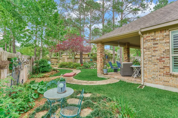 a view of a house with garden and porch