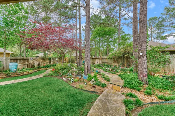 an aerial view of a house with outdoor space