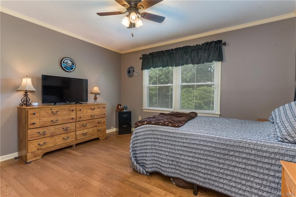 4600 Maple Creek Road Rutherfordton, NC 28139 - Photo 22 of 45 a bedroom with a bed and a flat screen tv