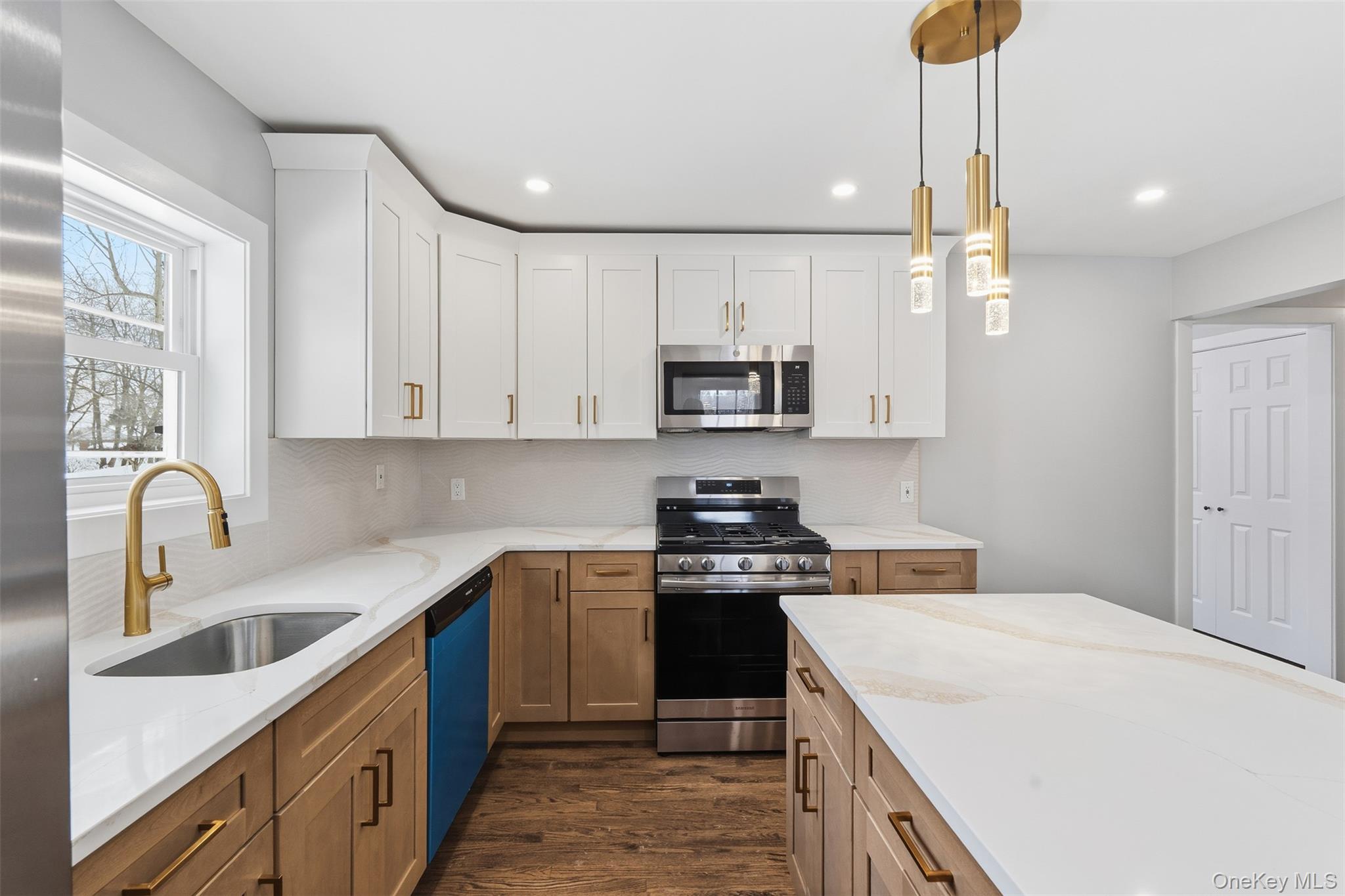 21 Janet Place Stony Point, NY 10980 - Photo 11 of 31 a kitchen with kitchen island granite countertop a sink a stove and cabinets