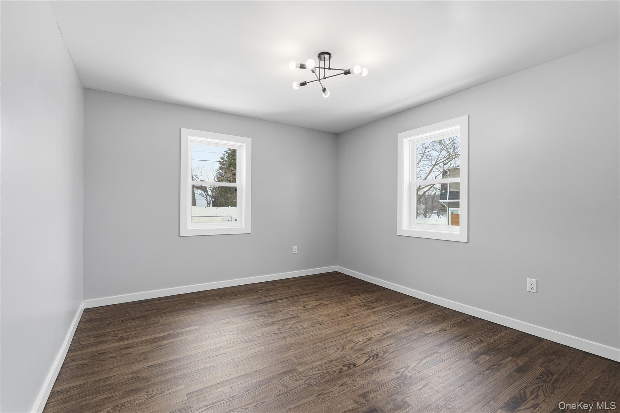 21 Janet Place Stony Point, NY 10980 - Photo 16 of 31 wooden floor in an empty room with a window
