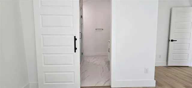 a bathroom with a glass shower door