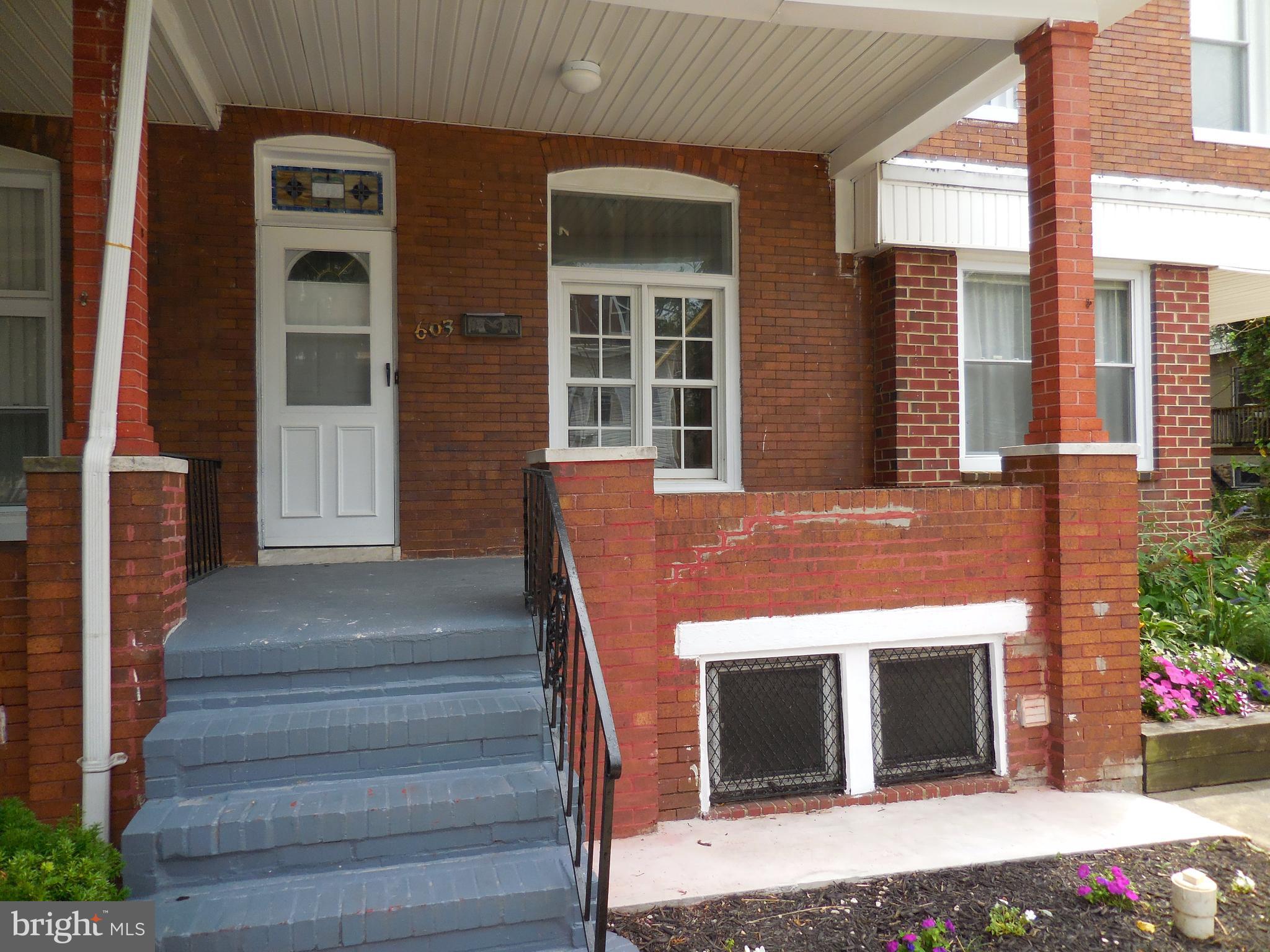 603 East 36th Street Baltimore, MD 21218 - Photo 1 of 29 a front view of a house with a yard