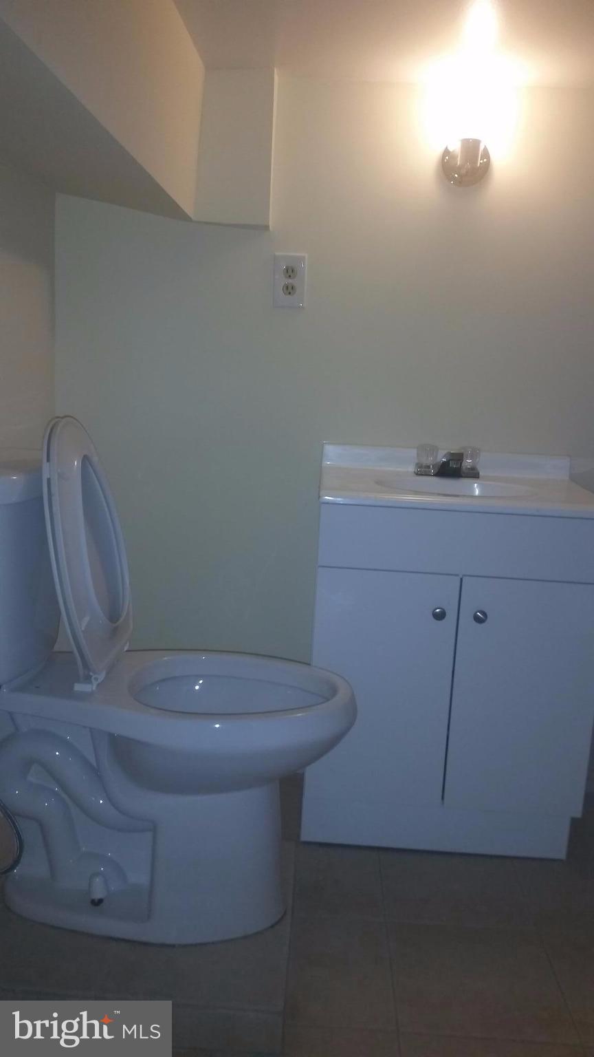 603 East 36th Street Baltimore, MD 21218 - Photo 23 of 29 a bathroom with a toilet