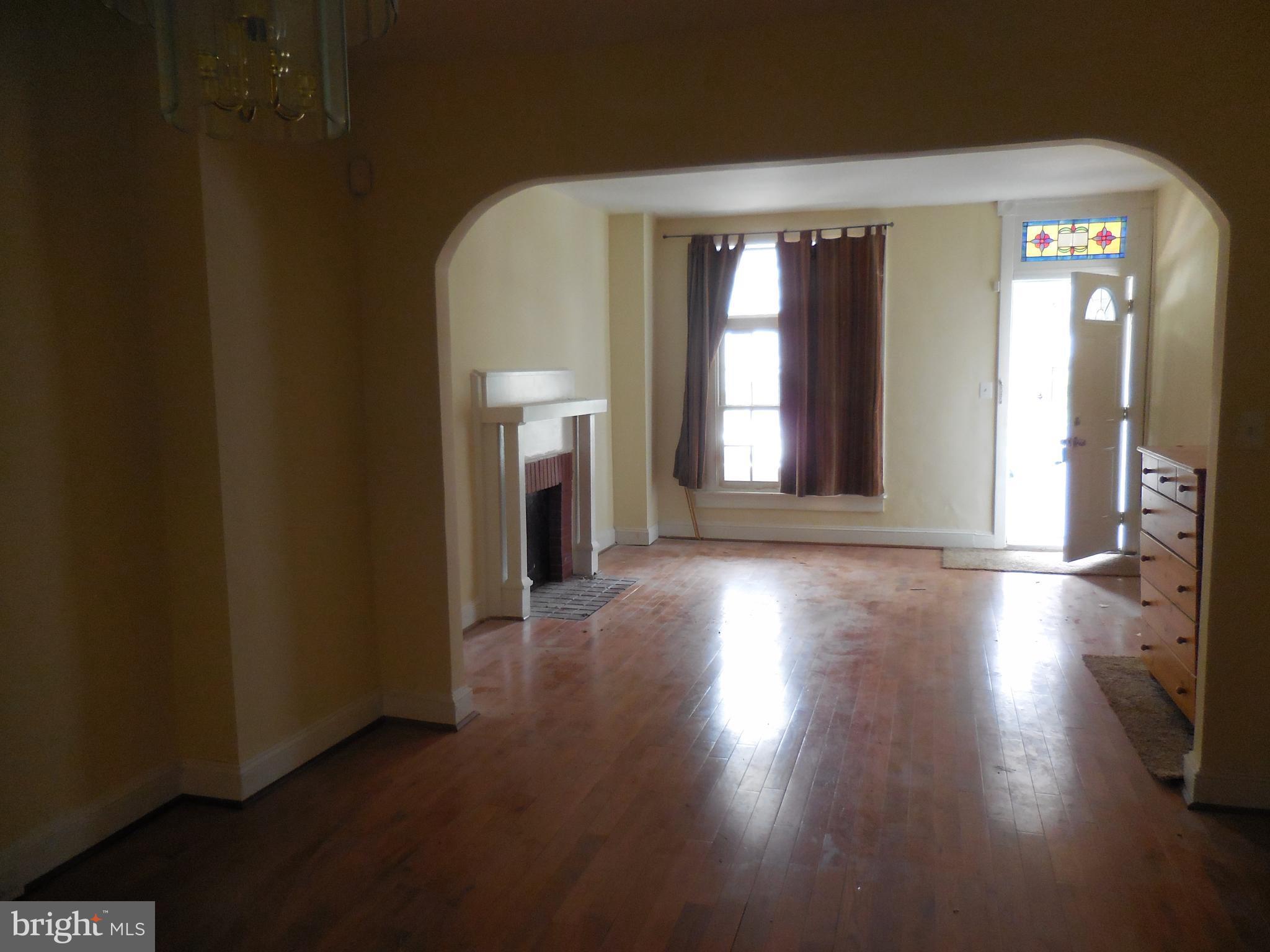 603 East 36th Street Baltimore, MD 21218 - Photo 4 of 29 a view of a room with large windows