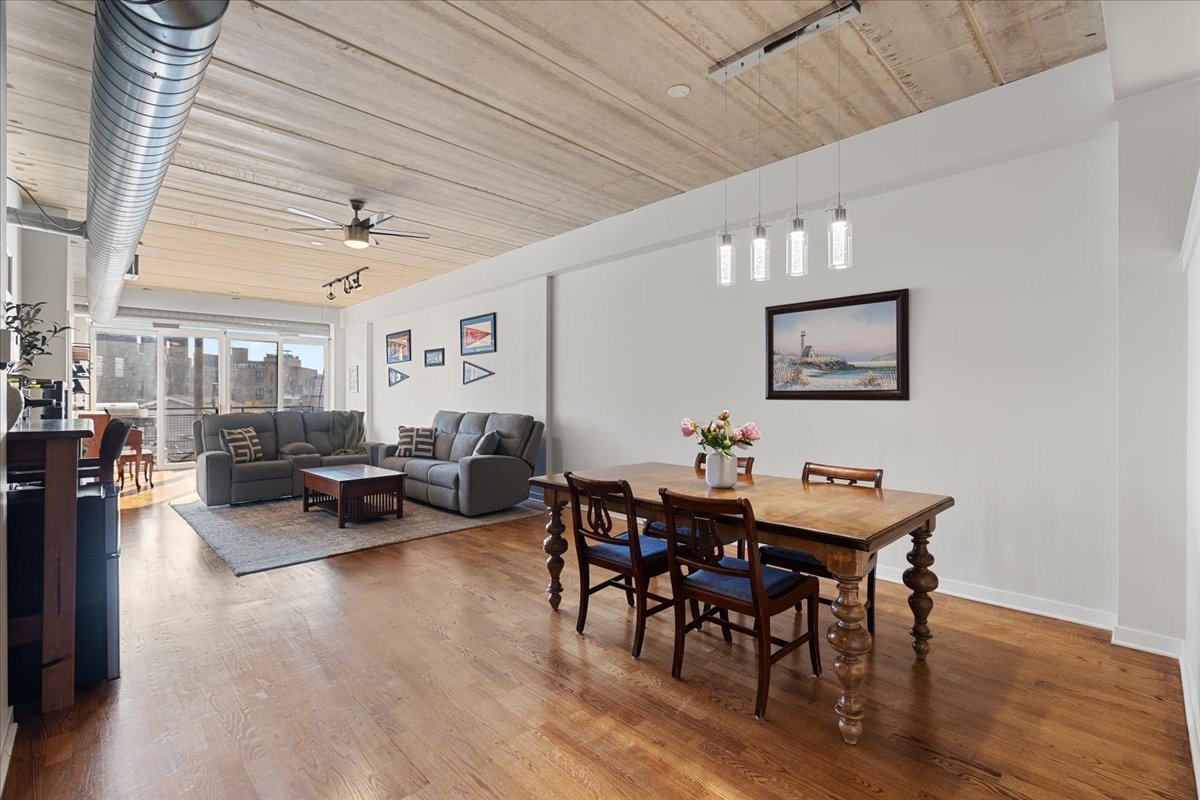 3260 North Clark Street, Unit 306 Chicago, IL 60657 - Photo 3 of 17 a living room with furniture and wooden floor
