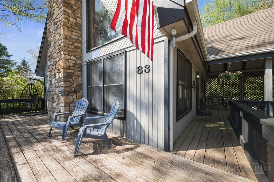 83 Pine Ridge Loop Newland, NC 28657 - Photo 26 of 32 a view of backyard with chair and wooden floor