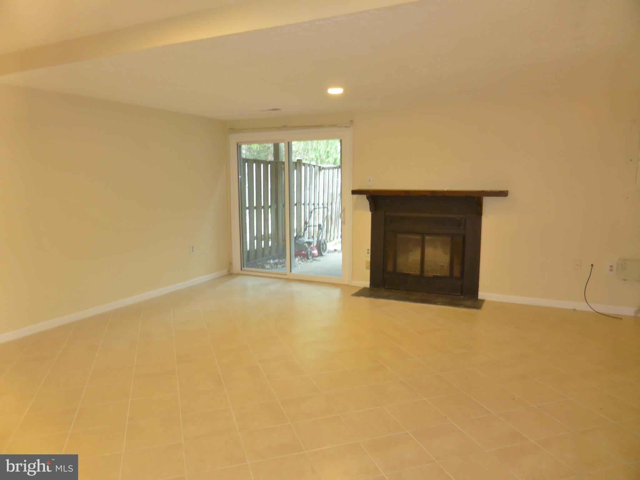 7326 Stream Way Springfield, VA 22152 - Photo 16 of 20 Walkout Rec Room w/ Fireplace