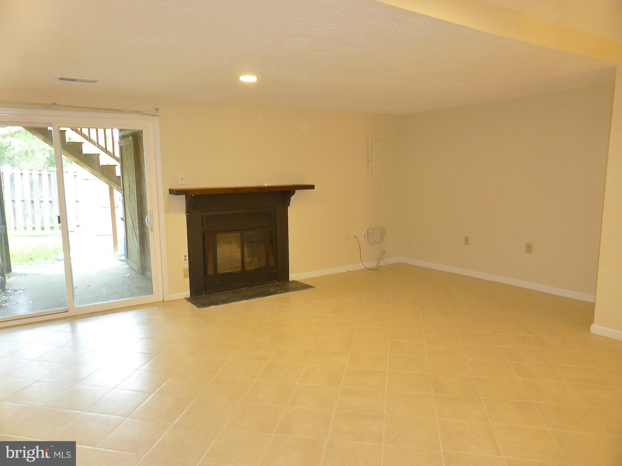 7326 Stream Way Springfield, VA 22152 - Photo 17 of 20 Walkout Rec Room w/ Fireplace
