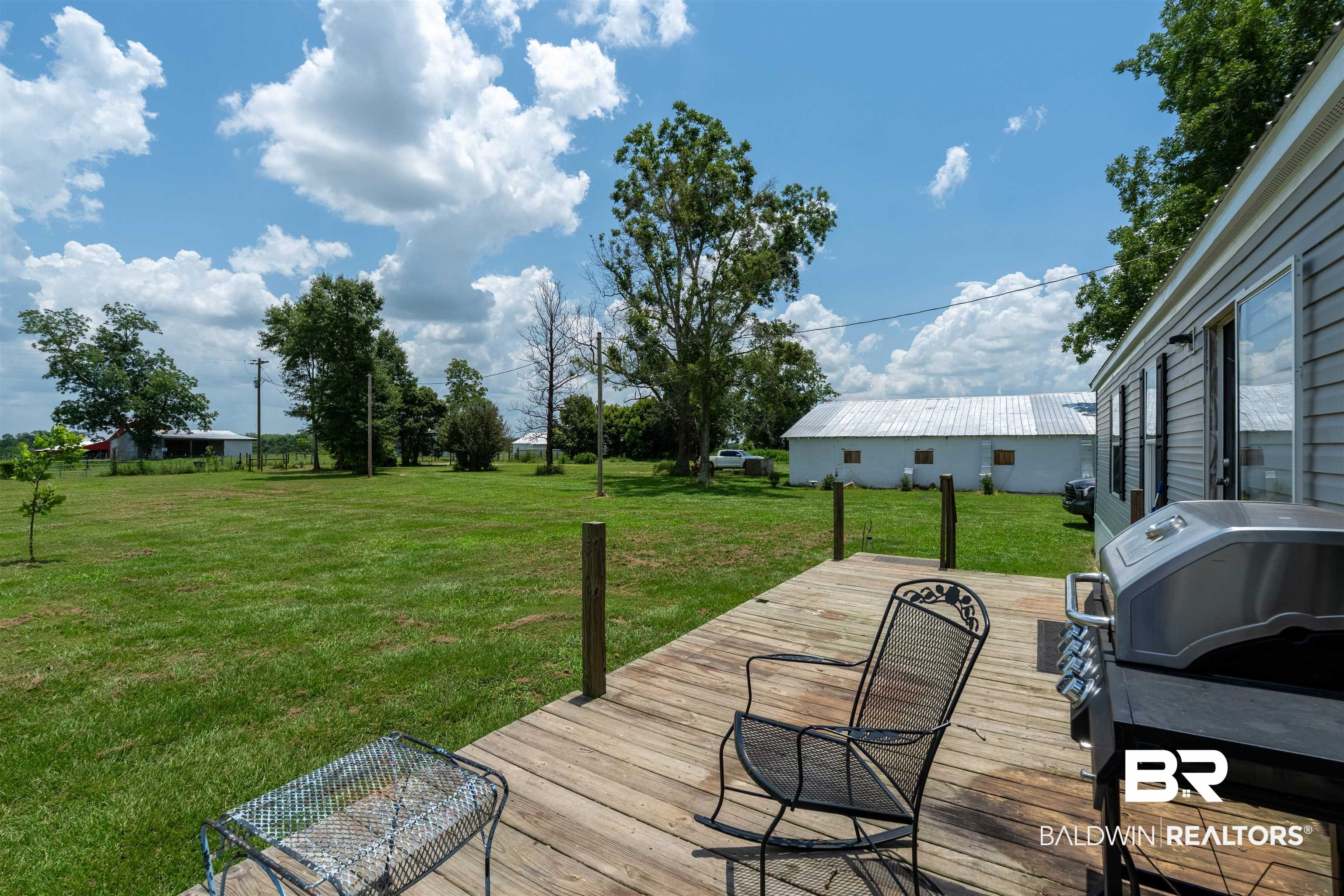 15575 Mikkelsen Road Summerdale, AL 36580 - Photo 39 of 68 Expansive wood-finish deck offering ample outdoor space