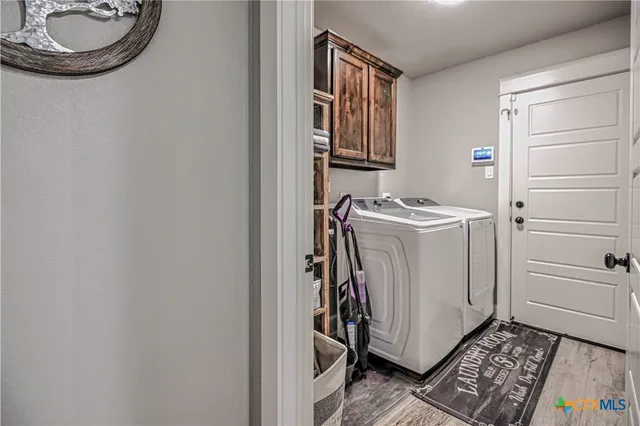 a storage room with a washer and dryer