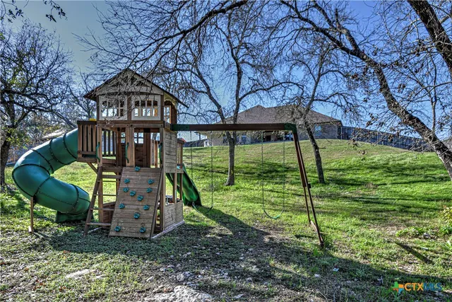 a view of a garden with a slide
