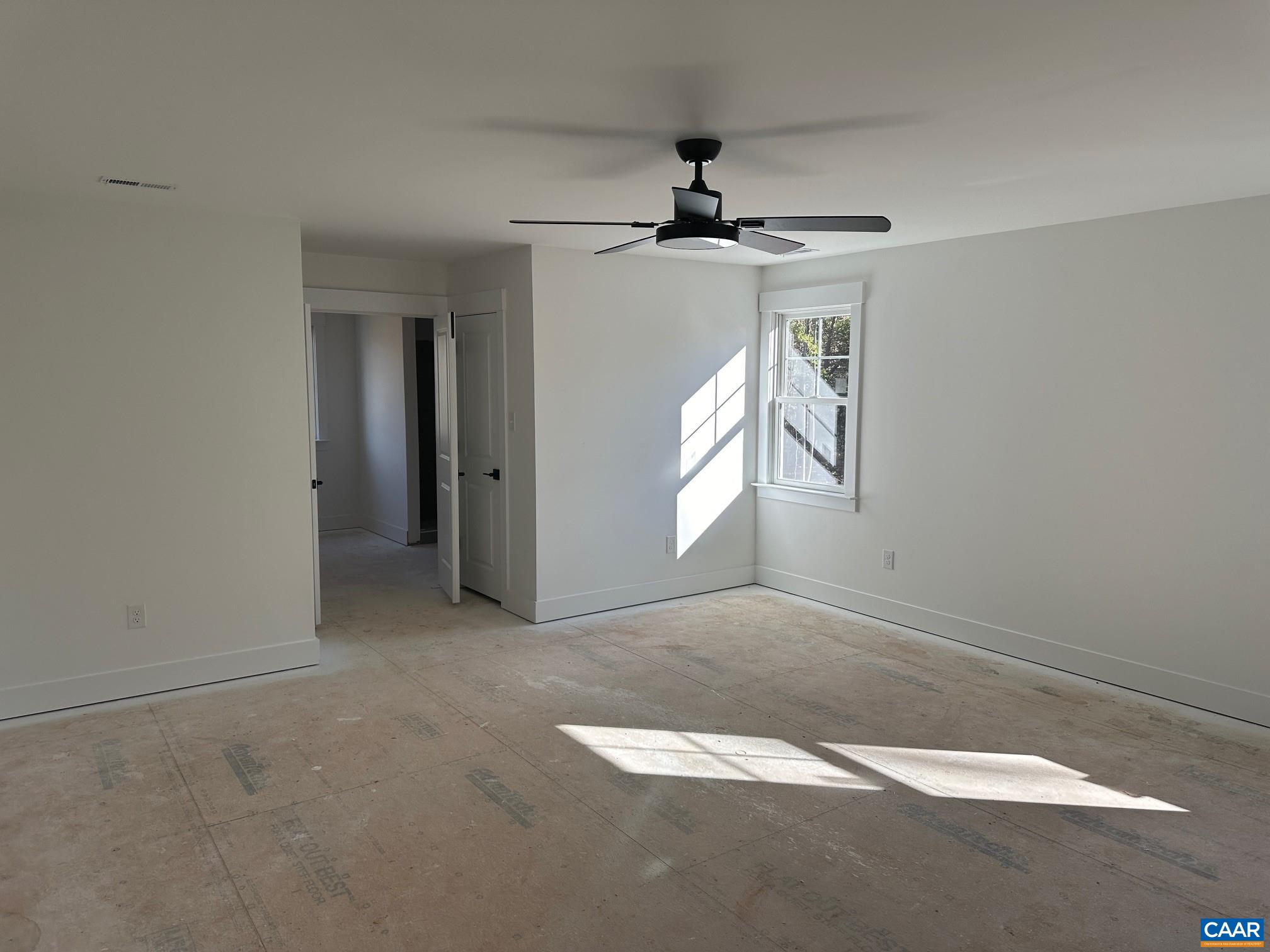 3662 West Rocketts Rdg Court Goochland, VA 23063 - Photo 13 of 20 an empty room with windows and fan