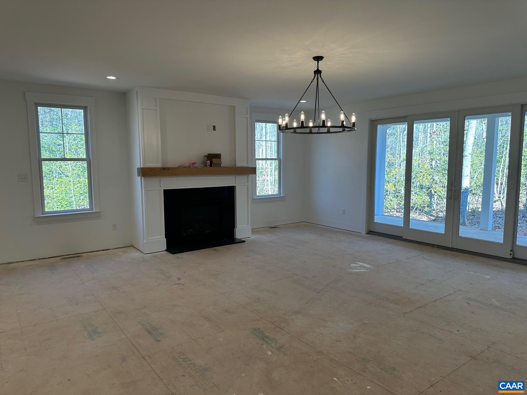 3662 West Rocketts Rdg Court Goochland, VA 23063 - Photo 5 of 20 an empty room with windows and fireplace
