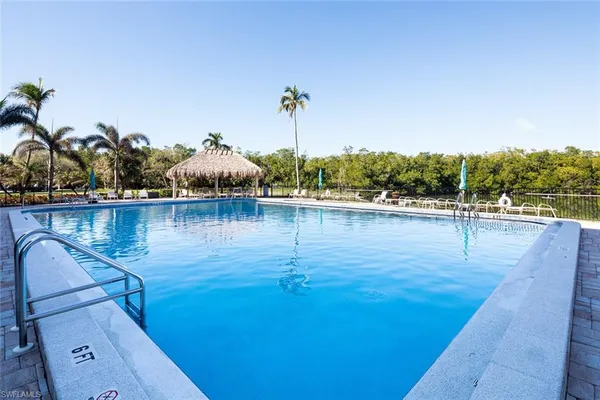 a view of a swimming pool and an outdoor space