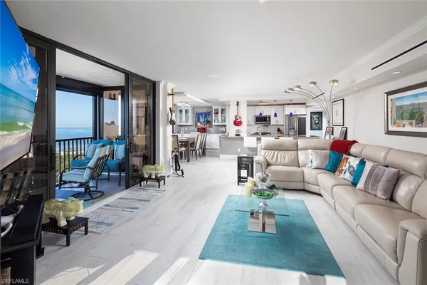 a living room with furniture and a rug