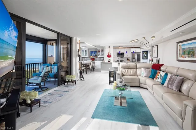 a living room with furniture and a rug