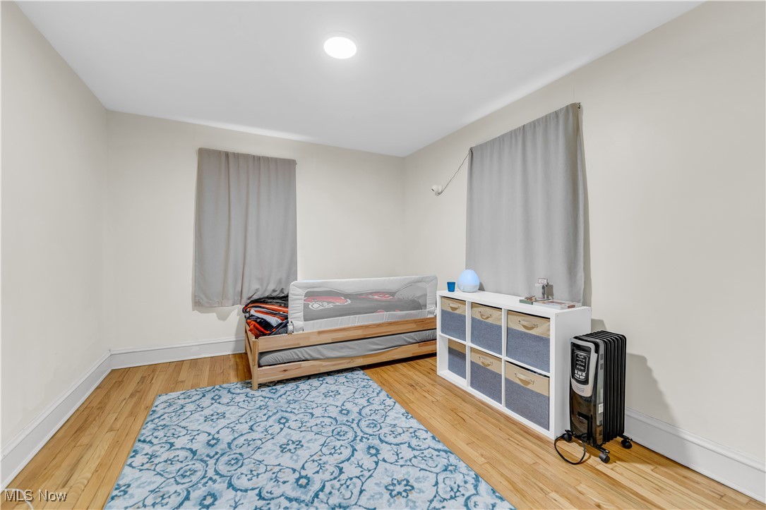 3729 Grosvenor Road Cleveland, OH 44118 - Photo 26 of 39 Bedroom featuring wood finished floors and baseboards