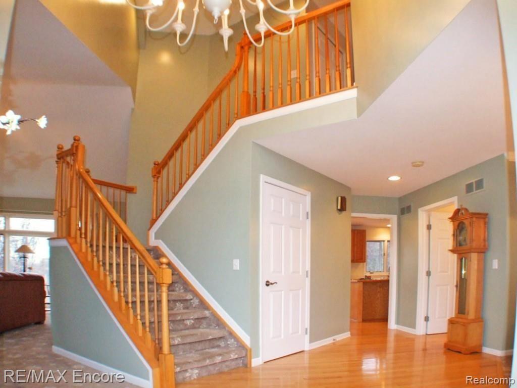 5458 Ridge Trail North Clarkston, MI 48348 - Photo 2 of 35 GLEAMING HARDWOOD FLOORS IN ENTRY WITH NEW CARPET