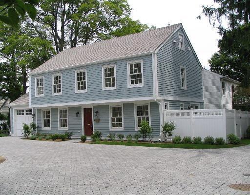 31 Catoonah Street, Unit B Ridgefield, CT 06877 - Photo 1 of 1 a front view of a house with a yard and a garage