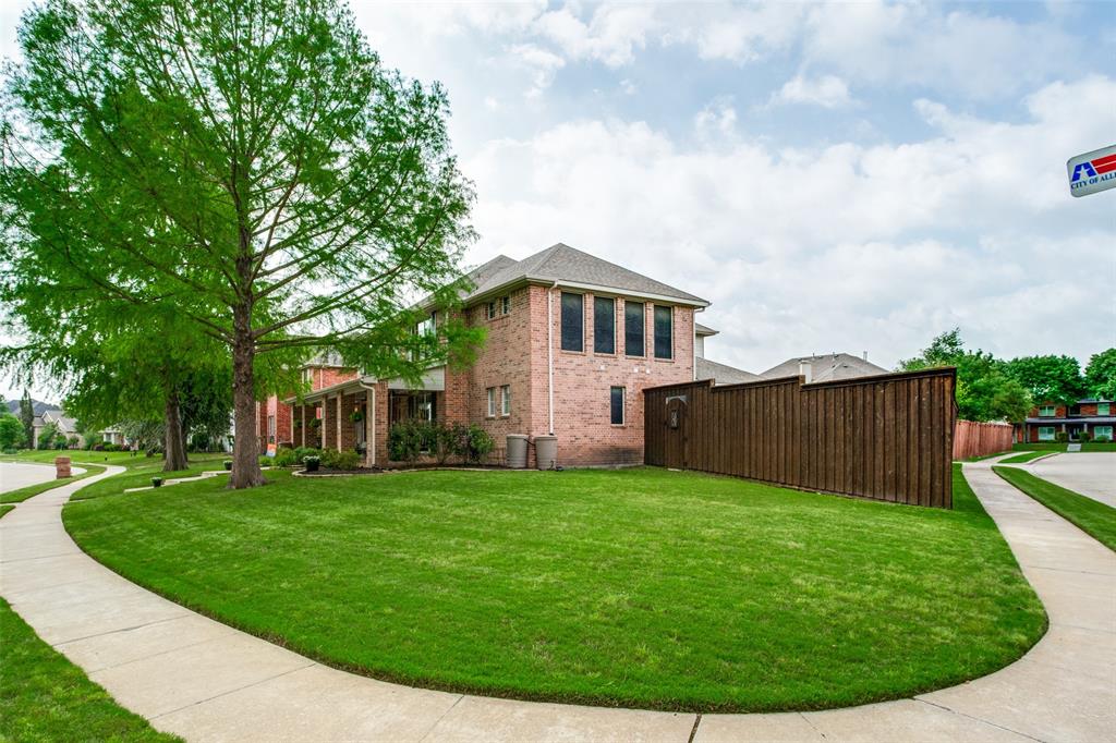 1612 Coventry Lane Allen, TX 75002 - Photo 34 of 39 Spacious corner lot featuring a brick-clad residence, mature trees, a manicured lawn, and a privacy fence