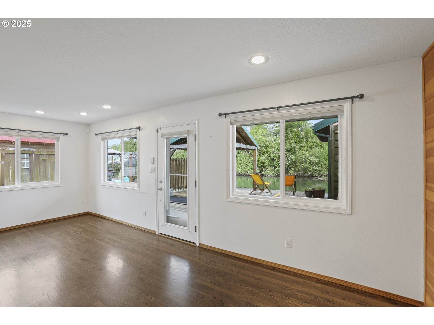 50776 Dike Road, Unit 4 Scappoose, OR 97056 - Photo 14 of 37 an empty room with wooden floor and windows