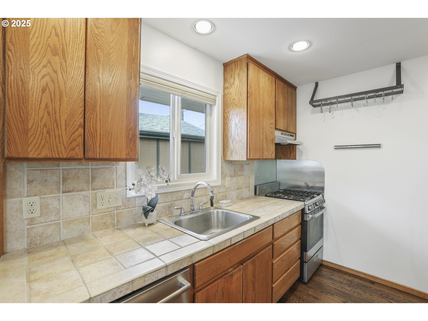 50776 Dike Road, Unit 4 Scappoose, OR 97056 - Photo 17 of 37 a kitchen with a sink cabinets and window