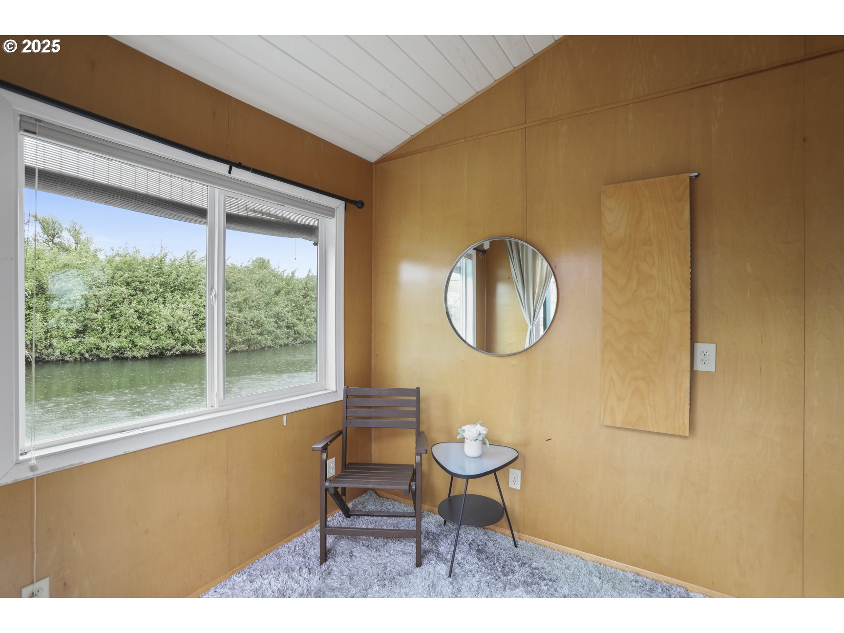 50776 Dike Road, Unit 4 Scappoose, OR 97056 - Photo 27 of 37 a living room with a table chairs and a large window