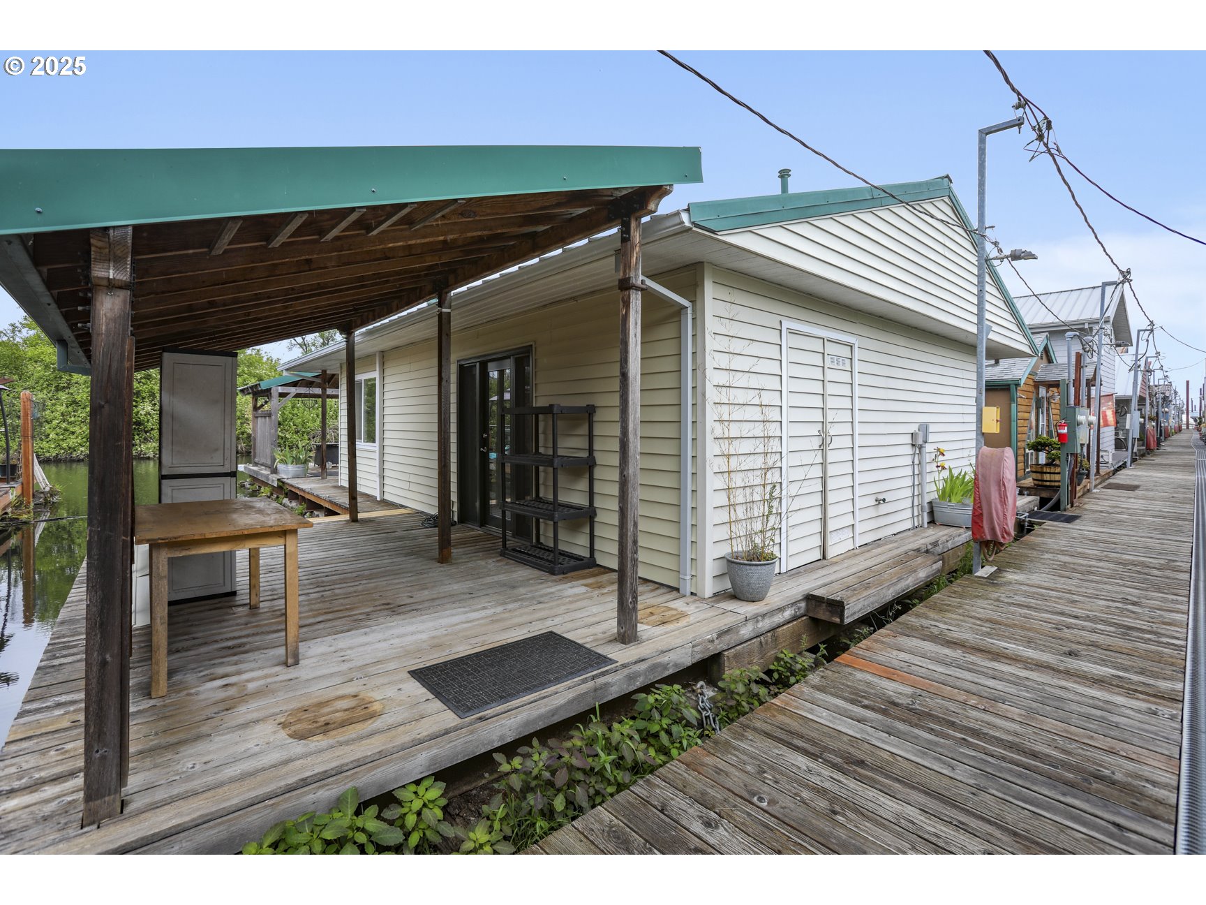 50776 Dike Road, Unit 4 Scappoose, OR 97056 - Photo 3 of 37 a view of a backyard with a patio and wooden floor
