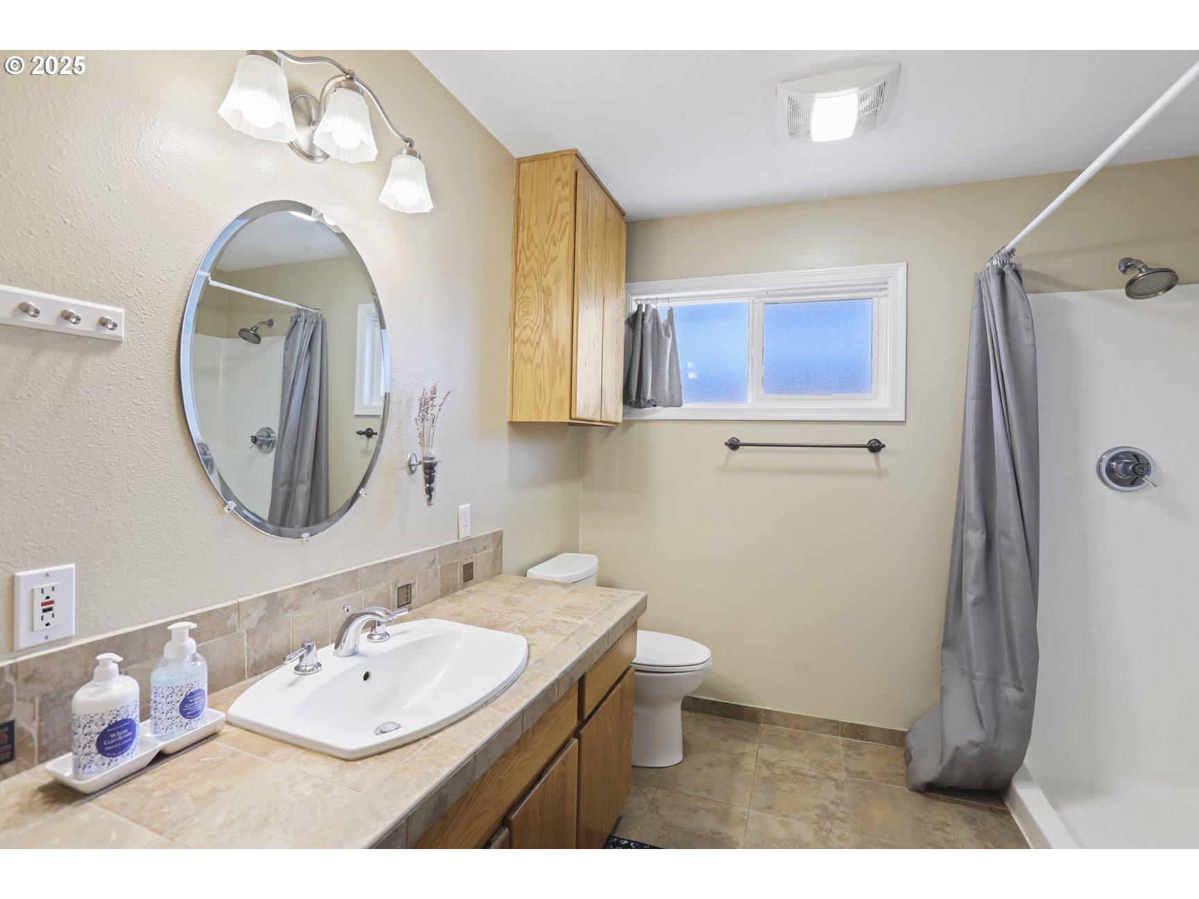 50776 Dike Road, Unit 4 Scappoose, OR 97056 - Photo 9 of 37 a bathroom with a sink mirror and toilet