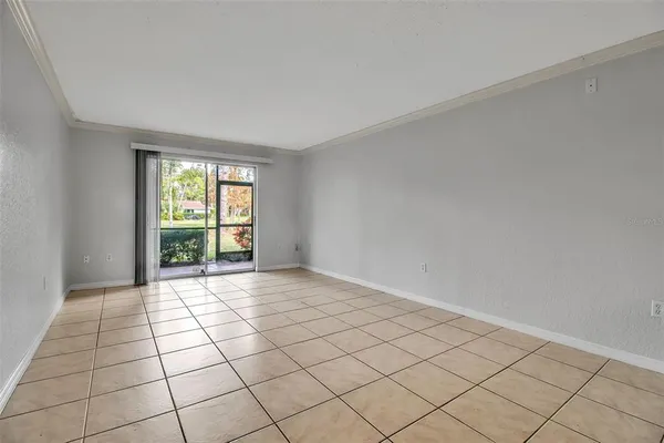 a view of an empty room and window