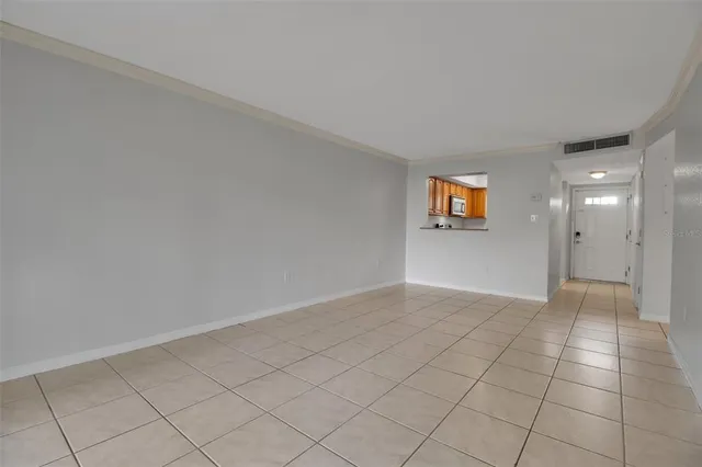 a view of an empty room and window