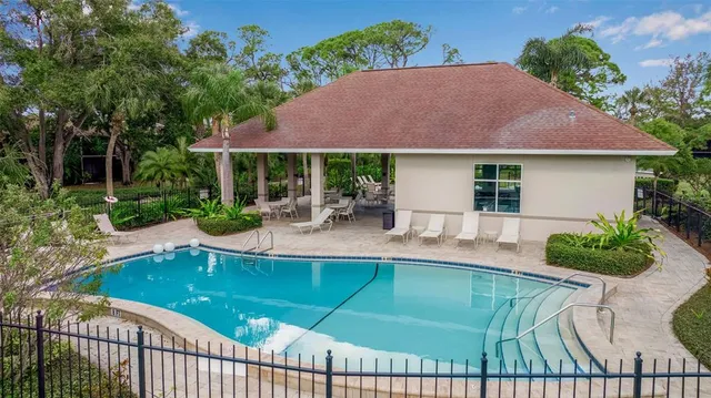 a view of a house with backyard porch and sitting area